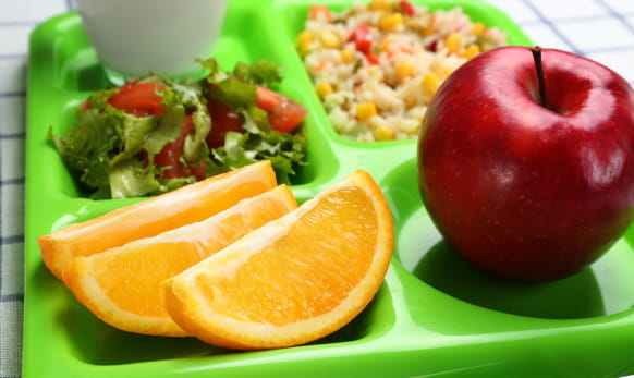 Summer fruits and vegetables on a school meal tray