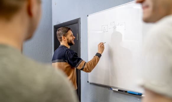 Man writing process on a whiteboard