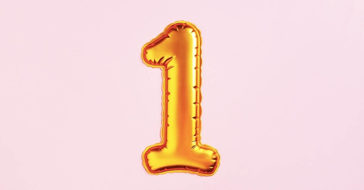 Image of a golden balloon of the number one on a pink background all-in-one school nutrition system