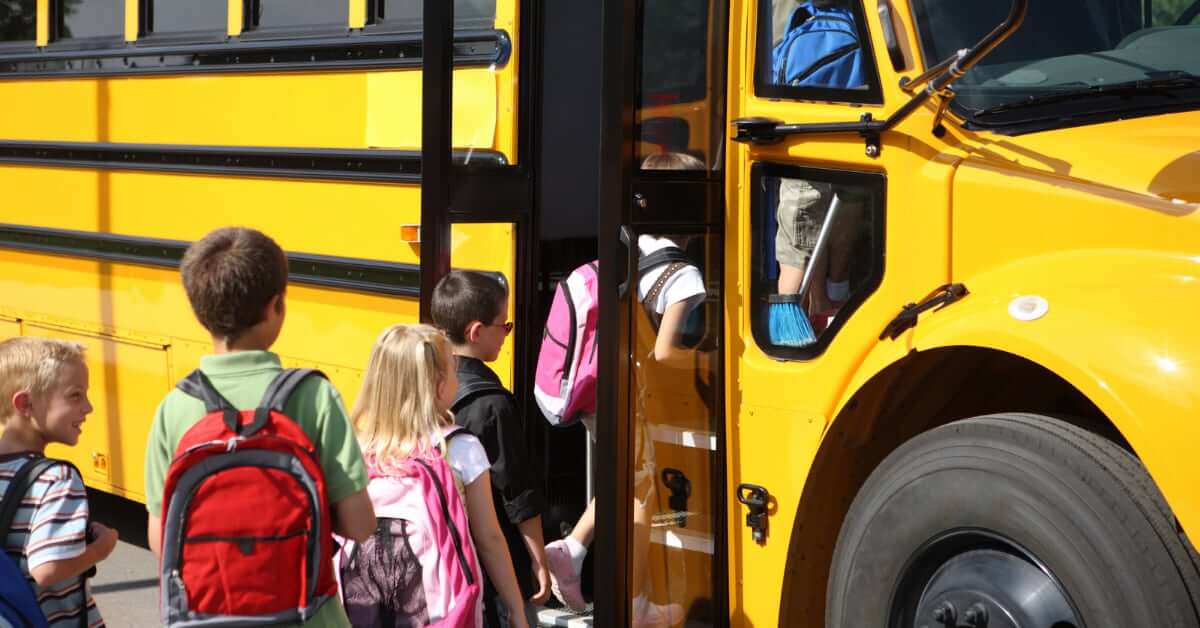 Children entering a school bus