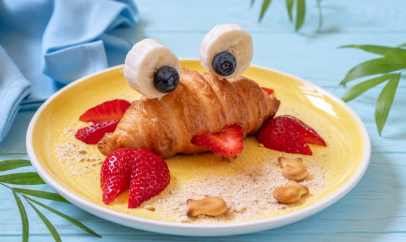 Fun Breakfast croissant and strawberries