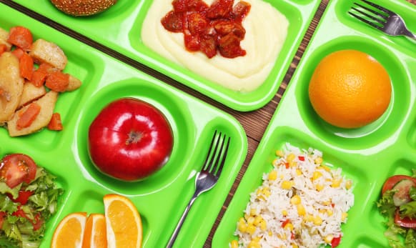 Bold colorful food on school food trays