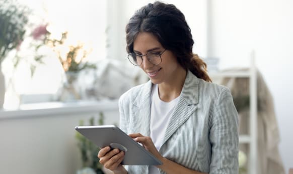 Woman looking at digital trends on her tablet