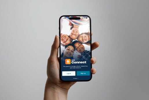 Parent holding phone looking at LINQ Connect app