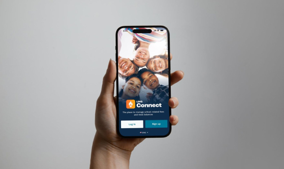 Parent holding phone looking at LINQ Connect app