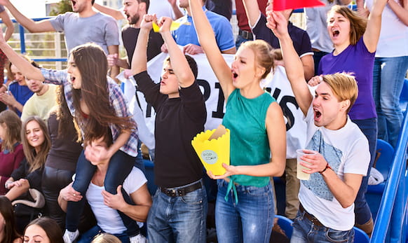 Image of students cheering at high school sporting event