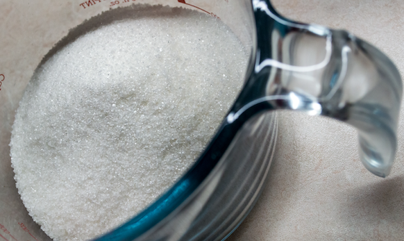 Sugar in a measuring cup